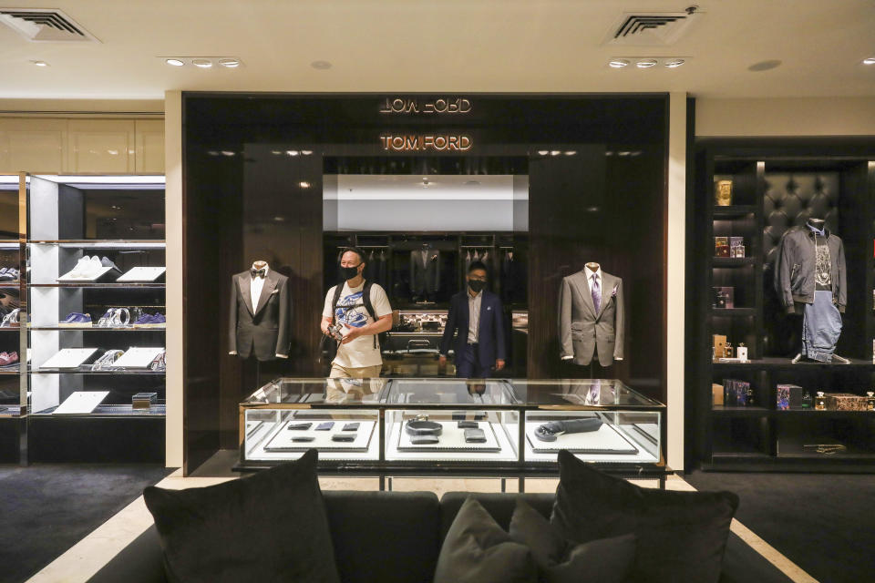 A customer visits high end luxury boutique department store Harrolds in Melbourne, Australia, Wednesday, Oct. 28, 2020. (AP Photo/Asanka Brendon Ratnayake)