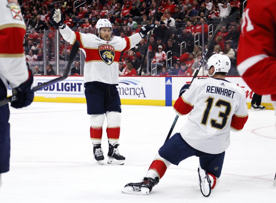 Florida Panthers defenseman Brandon Montour (62) celebrates a goal by Florida Panthers center Sam Reinhart (13) during the second period of an NHL hockey game against the Detroit Red Wings Saturday, March 2, 2024, in Detroit. (AP Photo/Duane Burleson)