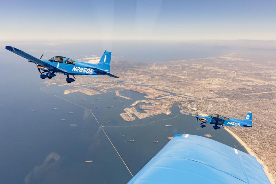 The Skytypers planes fly over Long Beach in diamond formation.