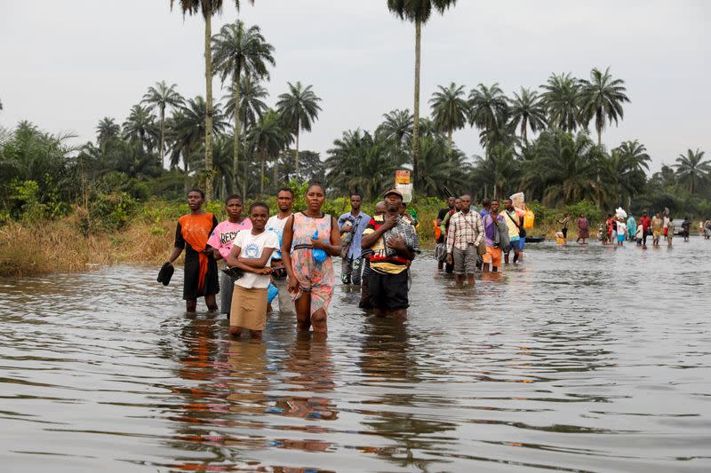 FILE PHOTO: Residents wade through flood water in Obagi community, Rivers state