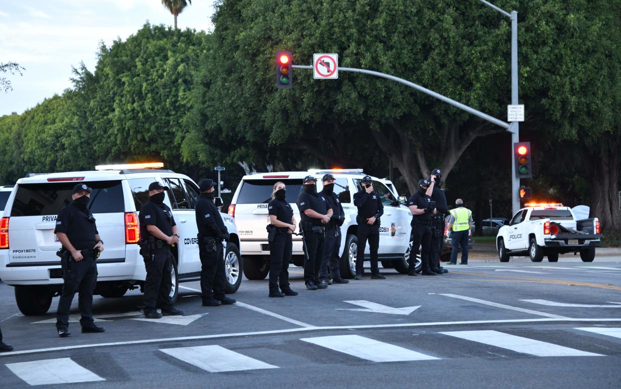 <p>Police officers direct traffic during a pro-Trump demonstration in Beverly Hills, November 1, 2020.</p> ((Photo by Chris DELMAS / AFP) )