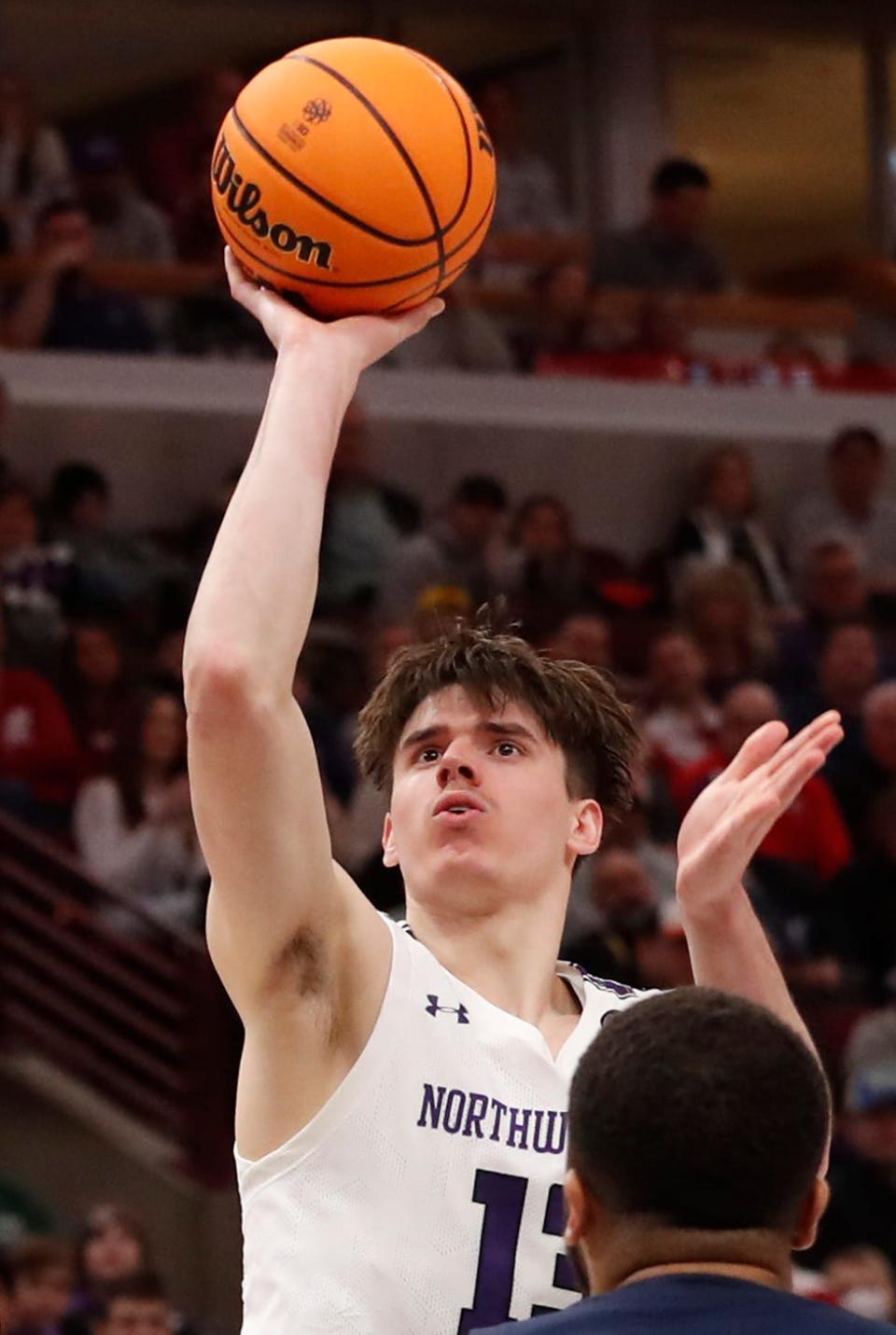 Northwestern Wildcats guard Brooks Barnhizer (13) shoots the ball during the Big Ten Men’s Basketball Tournament game against the Penn State Nittany Lions, Friday, March 10, 2023, at United Center in Chicago. Penn State won 67-65 in overtime. 