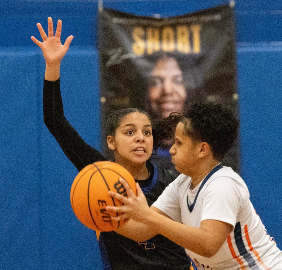 Manchester Marisiya Gains plays a tight defense against Overbook’s Zahaishs Nevius. Manchester Girls Basketball advances in state tournament play against Overbrook as Devyn Quigley surpassed the all-time scoring record on the Shore. against