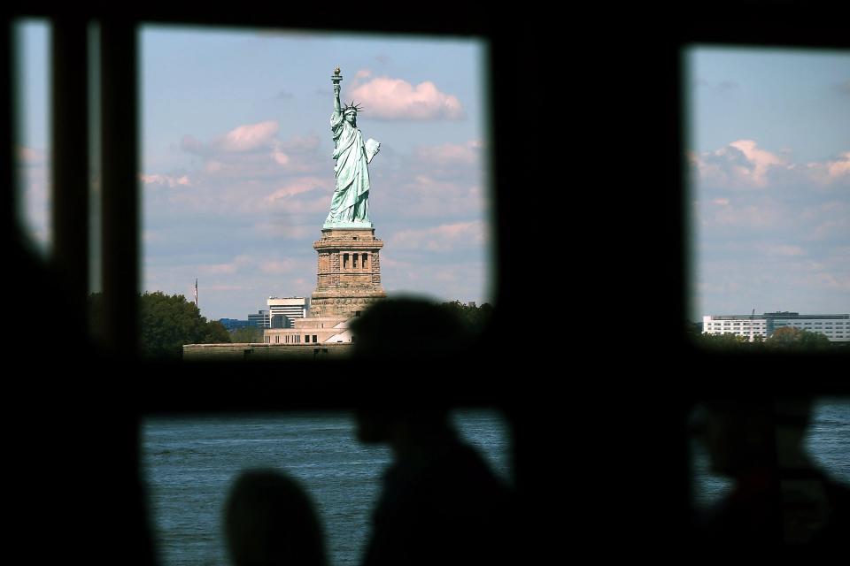 The Statue of Liberty in New York City used to welcome immigrants. In May 1924, President Calvin Coolidge signed the National Origins Quota Act, which included the first permanent cap on legal immigration. From 1888 to 1921, 98% of applicants for permanent residence were approved, according to the Cato Institute. Every year since 1924, a minority has been approved.