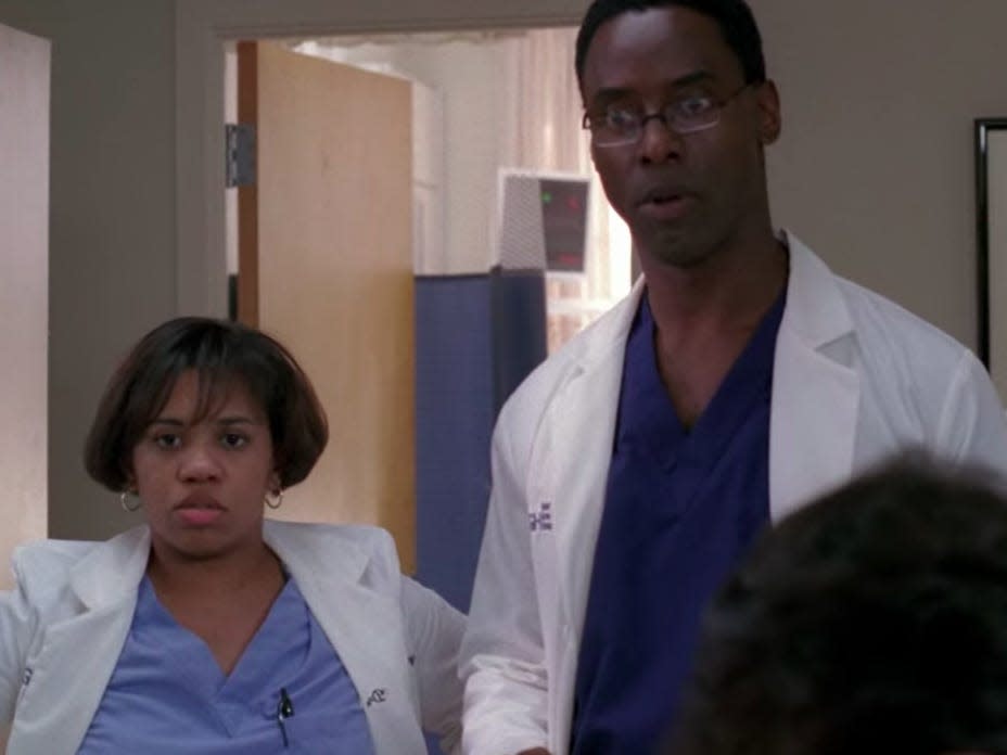 Burke and Bailey in scrubs and coats in a hospital room on Greys Anatomy