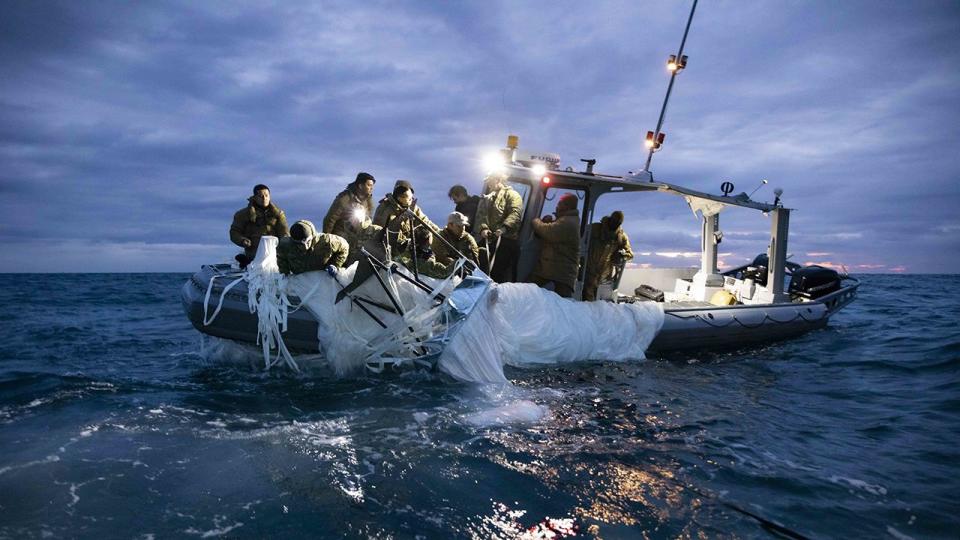 Sailors assigned to Explosive Ordnance Disposal Group 2 recover a high-altitude surveillance balloon off the coast of Myrtle Beach, South Carolina, Feb. 5, 2023. EODGRU 2 is a critical part of the Navy Expeditionary Combat Force that clears explosive hazards to provide access to denied areas; secures the undersea domain for freedom of movement; builds and fosters relationships with trusted partners, and protects the homeland. At the direction of the President of the United States and with the full support of the Government of Canada, U.S. fighter aircraft under U.S. Northern Command authority engaged and brought down a high altitude surveillance balloon within sovereign U.S. airspace and over U.S. territorial waters Feb. 4, 2023.  Active duty, Reserve, National Guard, and civilian personnel planned and executed the operation, and partners from the U.S. Coast Guard, Federal Aviation Administration, and Federal Bureau of Investigation ensured public safety throughout the operation and recovery efforts.