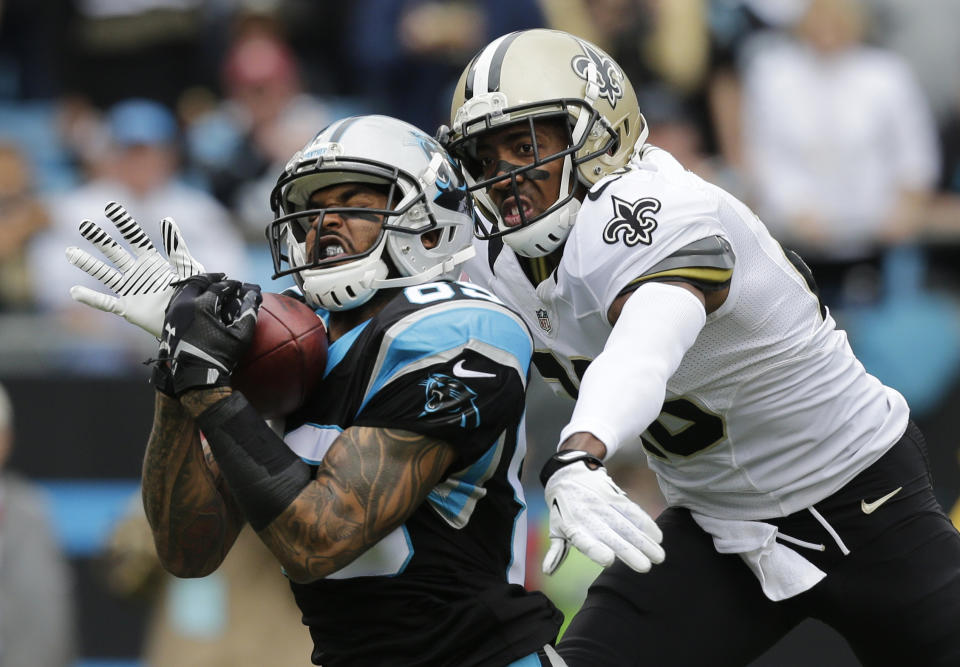 FILE - In this Dec. 22, 2013, file photo, Carolina Panthers' Steve Smith, left, catches a pass as New Orleans Saints' Keenan Lewis, right, defends in the first half of an NFL football game in Charlotte, N.C. The Panthers released their all-time leading receiver on Thursday, March 13, 2014, after 13 seasons. (AP Photo/Chuck Burton, File)