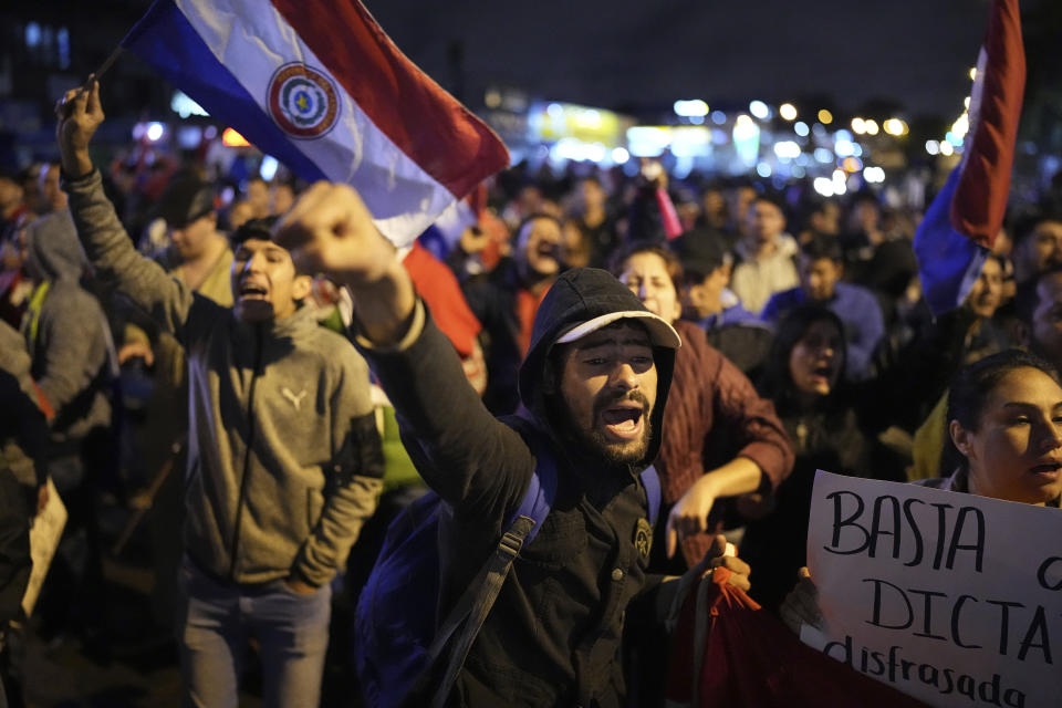 Supporters of National Crusade Party presidential candidate, Paraguayo Cubas, protest outside the Electoral Tribunal building, in Asuncion, Paraguay, Friday, May 5, 2023. Police on Friday detained Cubas, a far-right populist who came in third in Sunday’s presidential election and had alleged without evidence the vote was marred by fraud. (AP Photo/Jorge Saenz)