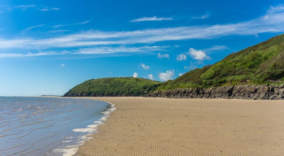 <p>A large and tranquil beach with views across the River Towy to Ferryside, Llansteffan is a well-kept secret and offers soft sand to sit on and firm sand for building sandcastles. Use Llansteffan Castle, which looms above the beach, as your inspiration for building an epic sandcastle in this family-friendly location. The beach is covered with cockle shells and the rock pools are full of life, perfect for exploring with little ones.</p><p><strong>Where to stay:</strong> You can book a stay at Cockleshell, a four-bedroom holiday cottage beneath the ancient castles and overlooking the swirling sea. The interior is stylish, with a contemporary kitchen and furnishings.</p><p><a class="link " href="https://airbnb.pvxt.net/7mqymQ" rel="nofollow noopener" target="_blank" data-ylk="slk:SEE INSIDE;elm:context_link;itc:0;sec:content-canvas">SEE INSIDE</a></p>