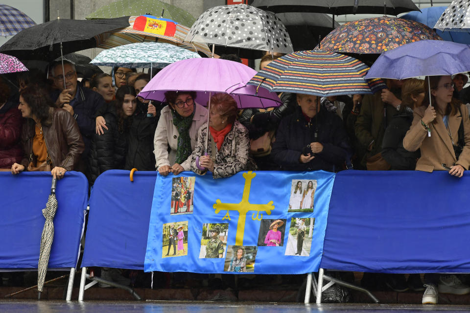 People wait outside the Campoamor theatre for the arrivals to the Prince of Asturias Awards ceremony in Oviedo, northern Spain, Friday, Oct. 20, 2023. The awards, named after the heir to the Spanish throne, are among the most important in the Spanish-speaking world. (AP Photo/Alvaro Barrientos)