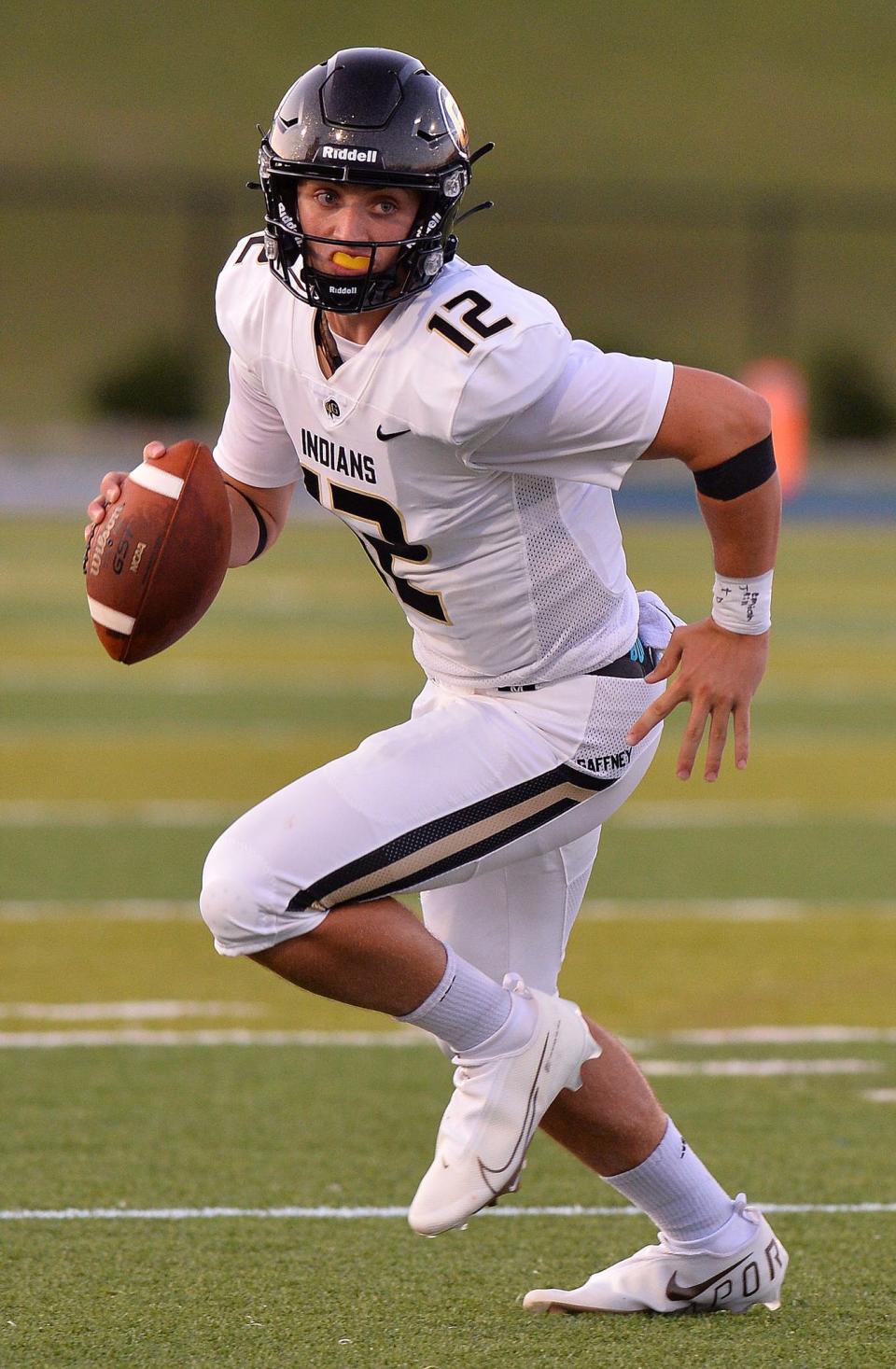 Gaffney quarterback Grayson Loftis runs the ball for yardage against Spartanburg.