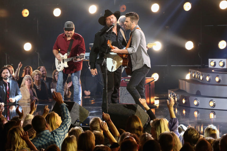 Garth Brooks and Mitch Rossell perform onstage at the 51st annual CMA Awards at the Bridgestone Arena on November 8, 2017 in Nashville, Tennessee. (Photo by Terry Wyatt/FilmMagic)