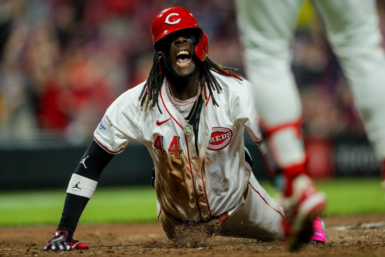 Reds shortstop Elly De La Cruz slides in for an inside-the-park home run in the seventh inning Monday night.