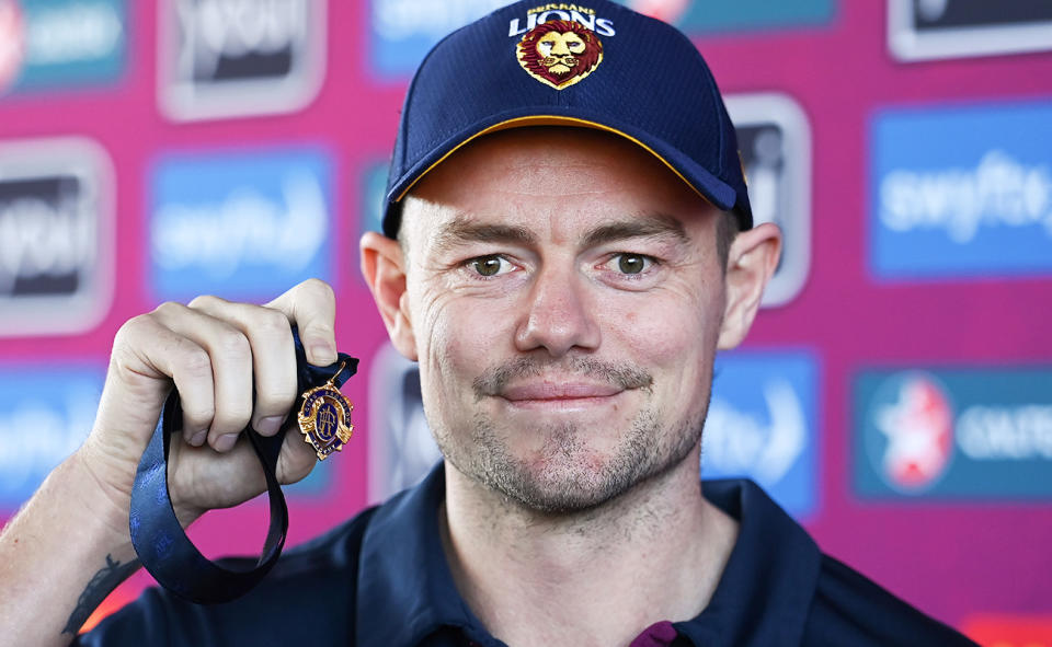 Lachie Neale, pictured here with the Brownlow Medal at a Brisbane Lions training session.