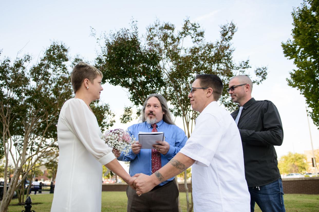 Dr. Emily Lenning gets married to Shay Davis in front of the Cumberland County Courthouse Monday, Oct. 13, 2014. They were the first first same-sex couple to legally marry in Cumberland County.