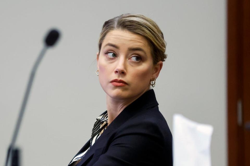 Actor Amber Heard listens in the courtroom at the Fairfax County Circuit Court in Fairfax, Va., Wednesday, April 27, 2022 (AP)