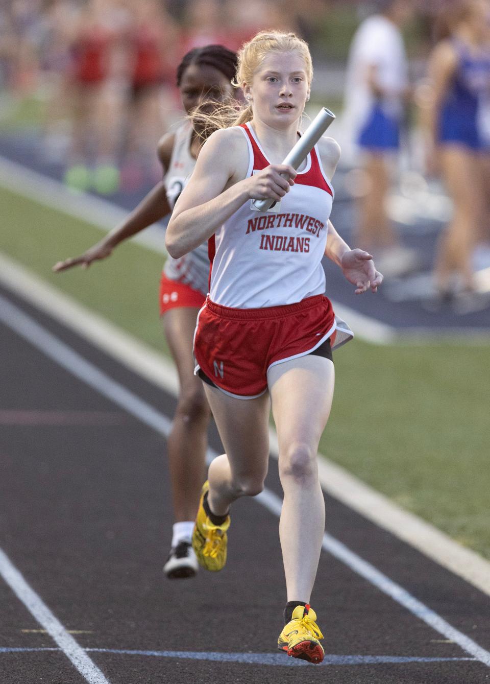 Northwest's Madelyn Begert runs the anchor leg of the girls 1,600-meter relay at last week's PAC-7 Track and Field Championships.