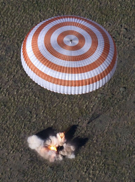 The Russian Soyuz space capsule with astronauts Tom Marshburn, Chris Hadfield and Roman Romanenko aboard lands in Kazakhstan on May 14, 2013. The landing marks the end of a half-year mission to the International Space Station that saw Hadfield shoot to global stardom through his Twitter microblog