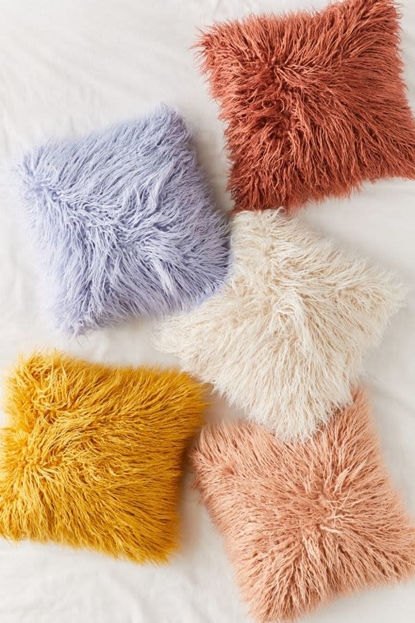 The next best thing to cuddling your childhood stuffed animal. <a rel="nofollow noopener" href="https://www.urbanoutfitters.com/shop/mila-faux-fur-throw-pillow" target="_blank" data-ylk="slk:SHOP NOW;elm:context_link;itc:0;sec:content-canvas" class="link ">SHOP NOW</a>: Mila Faux Fur Throw Pillow by Urban Outfitters, $39 each, urbanoutfitters.com