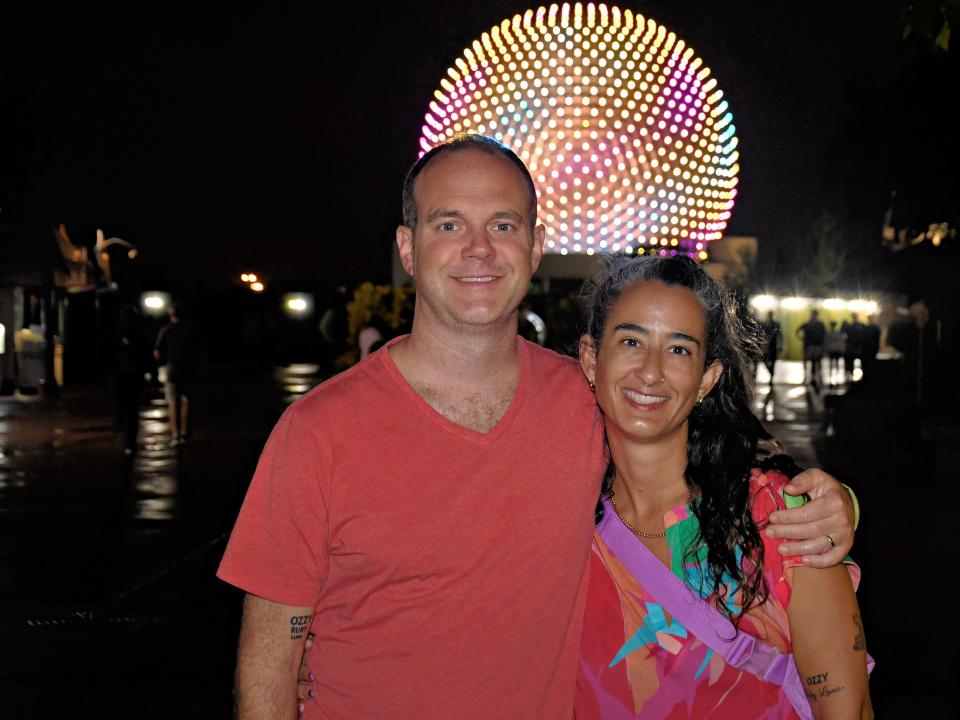 The author posing with her husband at Epcot