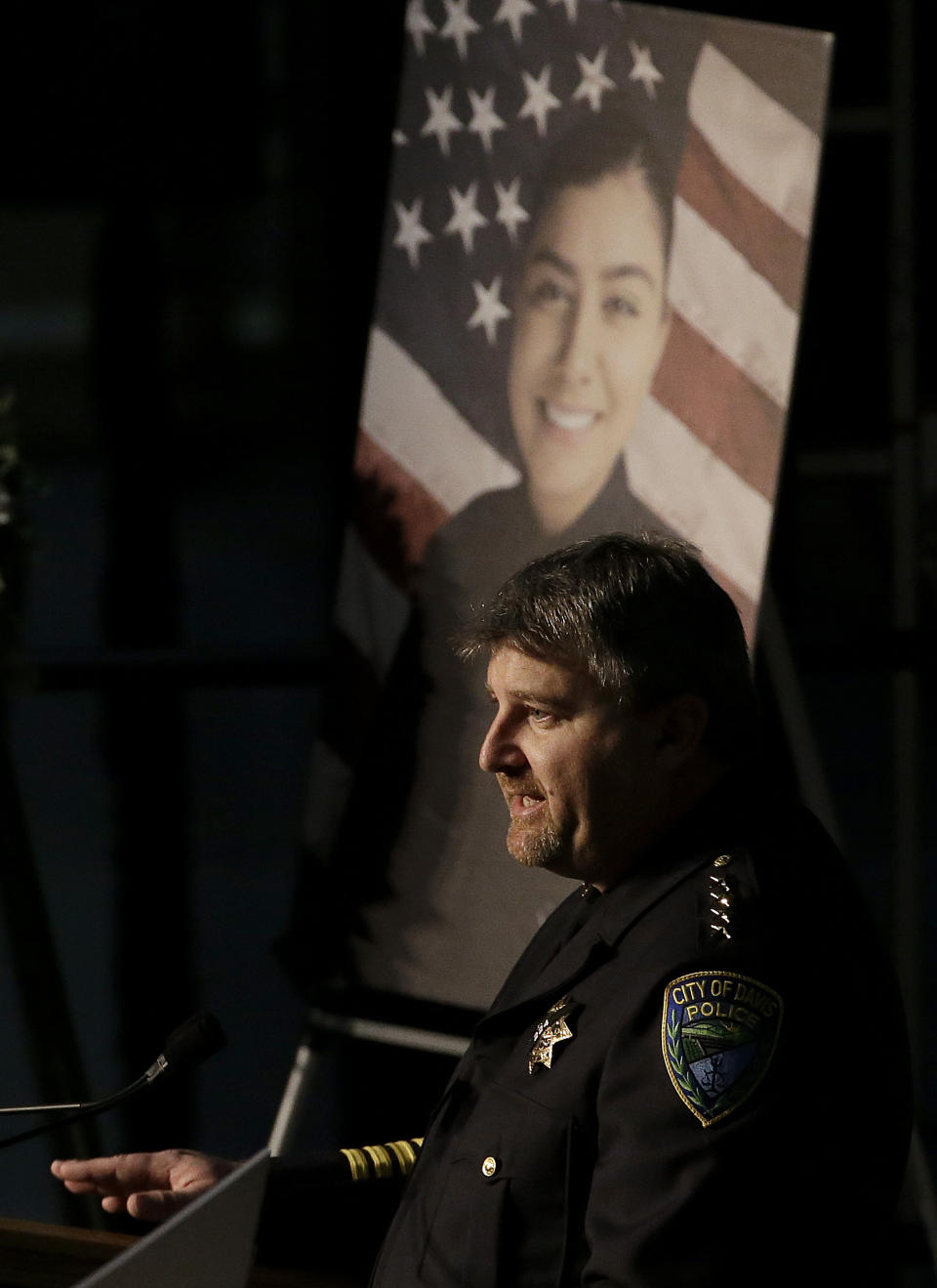 Davis Police Chief Darren Pytel speaks during funeral services for Davis Police Officer Natalie Corona at the University of California, Davis, Friday, Jan. 18, 2019, in Davis, Calif. Corona was was shot and killed Jan. 10, responding to scene of a three-car crash in Davis. Police say gunman Kevin Douglas Limbaugh, 48, not involved in the crash, rode up on a bicycle and without warning, opened fire on Corona. (AP Photo/Rich Pedroncelli, Pool)