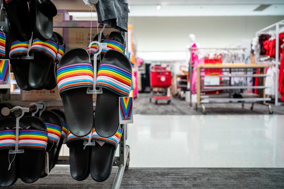 Colorful Pride Month slides on display at a Target store.