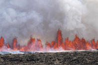 A volcano spews lava in Grindavik, Iceland, Wednesday, May 29, 2024. A volcano in southwestern Iceland is erupting, spewing red streams of lava in its latest display of nature's power. A series of earthquakes before the eruption Wednesday triggered the evacuation of the popular Blue Lagoon geothermal spa. The eruption began in the early afternoon north of Grindavik, a coastal town of 3,800 people that was also evacuated. (AP Photo/Marco di Marco)