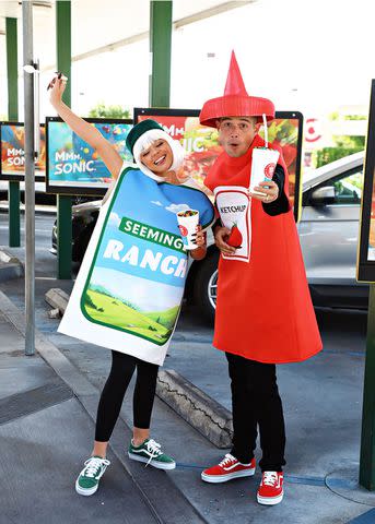 <p>Sara Jaye/Getty</p> Sarah Hyland and Wells Adams, in costume as Seemingly Ranch and Ketchup