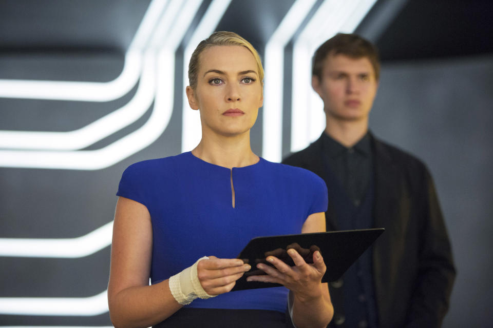 Kate holding an iPad-like device in the film