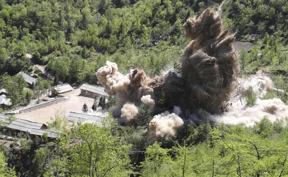 FILE - In this May 24, 2018, file photo, command post facilities of North Korea's nuclear test site are exploded in Punggye-ri, North Korea. With their second summit fast approaching, speculation is growing that U.S. President Donald Trump may try to persuade North Korean leader Kim Jong Un to commit to denuclearization by giving him something he wants more than almost anything else, an announcement of peace and an end to the Korean War. A combination of that strategy and the North’s repeated tests of missiles believed capable of delivering its nuclear weapons to the U.S. mainland are what brought the two countries to the negotiation table. (Korea Pool/Yonhap via AP, File)