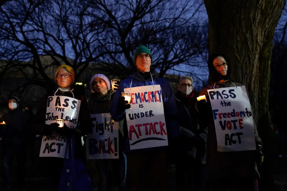 A candlelight vigil is held outside the Capitol building on Jan. 6, 2022, one year after the attack.