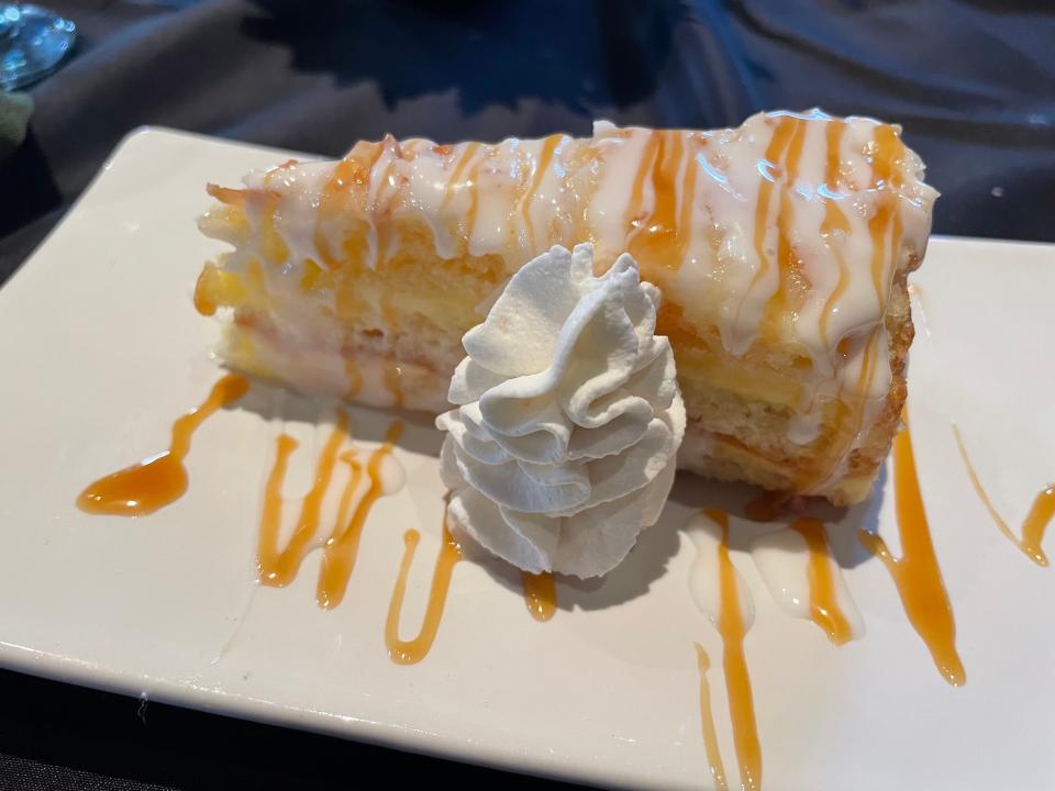 The coconut cream cake at Thistle & Brier is a two-layered treat topped with caramel.