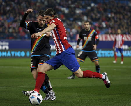 Football Soccer - Atletico Madrid v Rayo Vallecano - Spain King's Cup- Vicente Calderon stadium, Madrid, Spain - 14/1/16 Atletico Madrid's Filipe Luis and Rayo Vallecano's Joaquin Jose Marin Ã’QuiniÃ“ in action REUTERS/Susana Vera