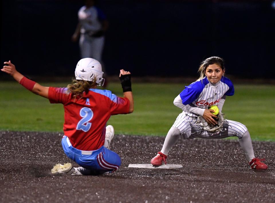 Cooper’s Jahlissah Marquez tags out Lubbock Monterey base runner Rylee O’Brien during Tuesday’s game in Abilene.