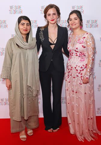 <p>Dave Benett/Getty Images</p> Malala Yousafzai, Emma Watson and Waad Al-Kateab attends the premiere screening of 'We Dare to Dream' in London.