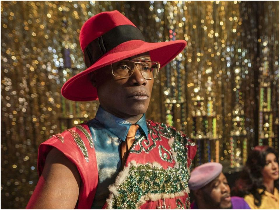 billy porter waring a red hat in "pose"