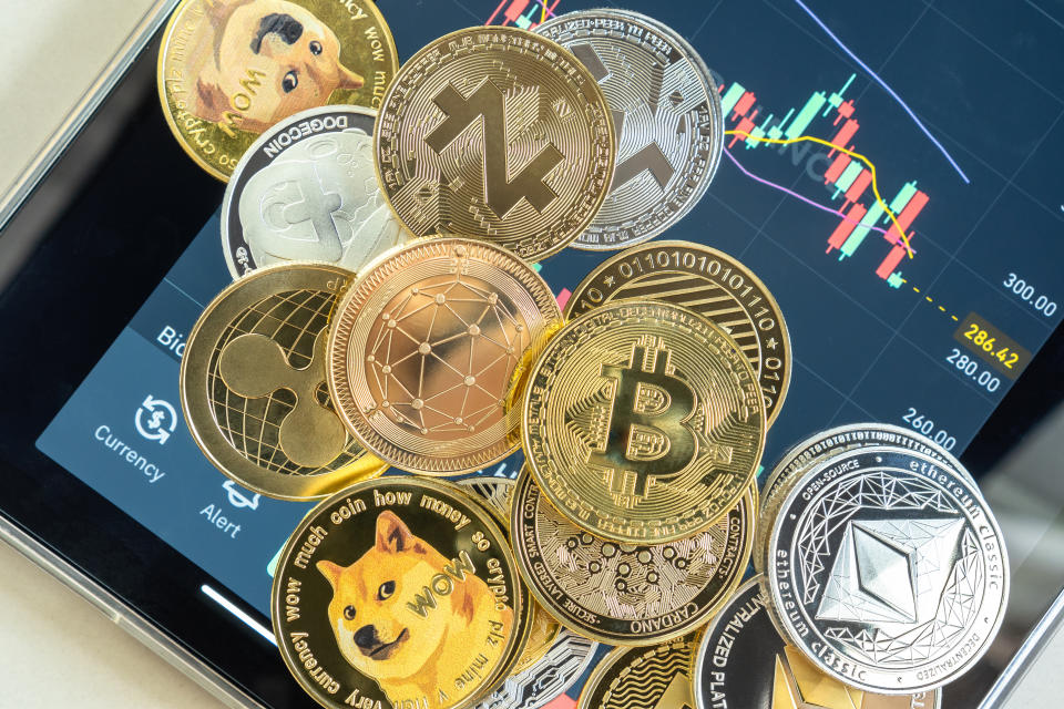 Bangkok, Thailand - 1 July 2021: Cryptocurrency on Binance trading app, Bitcoin BTC with altcoin digital coin crypto currency, BNB, Ethereum, Dogecoin, Cardano, defi p2p decentralized fintech market