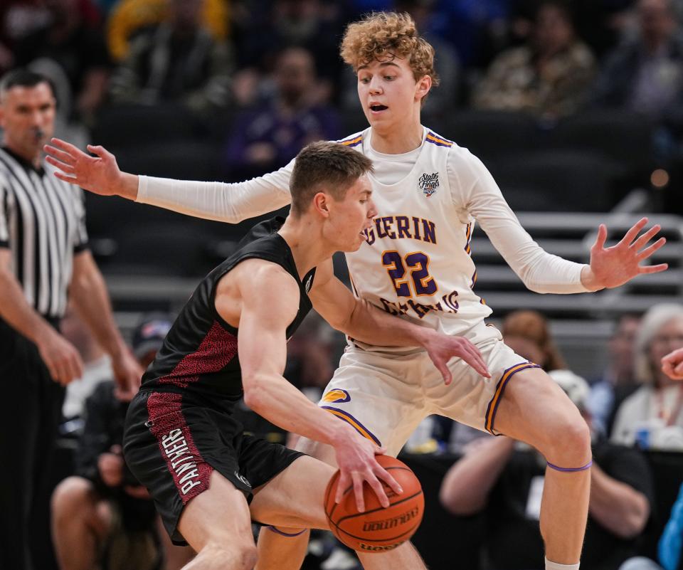 Guerin Catholic's Dylan Murans (22) defends in the 2023 Class 3A state finals.