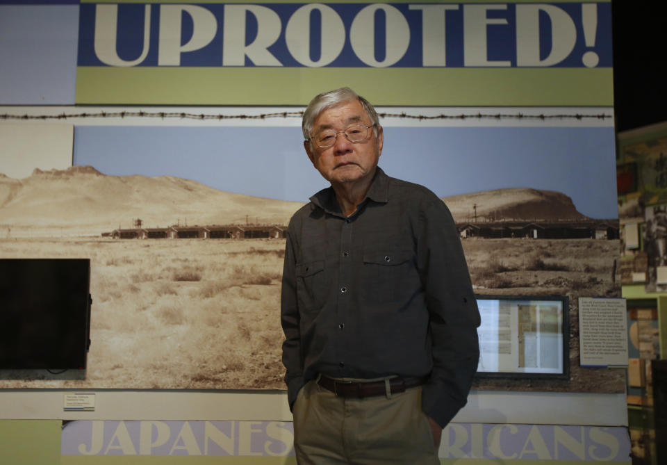 In this photo taken Tuesday, Feb. 11, 2020, Les Ouchida poses at the permanent exhibit titled "UpRooted Japanese Americans in World War II" at the California Museum in Sacramento, Calif. Ochida, who is a docent for the exhibit, was a child when his family was forced to move in 1942 from their home near Sacramento to an internment camp in Arkansas. Assemblyman Al Muratsuchi, D-Torrence has introduced a resolution to apologize for the state's role in carrying out the federal government's internment of Japanese-Americans. A similar resolution will be brought up before the state Senate by Sen. Richard Pan, D-Sacramento. (AP Photo/Rich Pedroncelli)