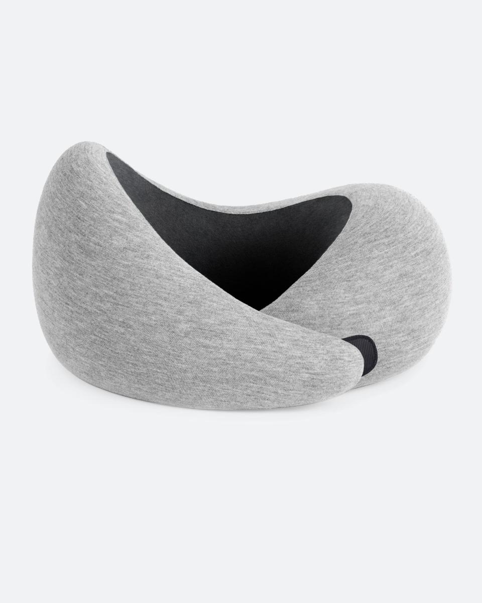 <p><strong>Ostrich Pillow</strong></p><p>ostrichpillow.com</p><p><strong>$60.00</strong></p><p><a href="https://go.redirectingat.com?id=74968X1596630&url=https%3A%2F%2Fostrichpillow.com%2Fen-us%2Fproducts%2Fgo-neck-pillow&sref=https%3A%2F%2Fwww.cosmopolitan.com%2Fstyle-beauty%2Ffashion%2Fg12838307%2Fwarm-cozy-gifts%2F" rel="nofollow noopener" target="_blank" data-ylk="slk:Shop Now" class="link ">Shop Now</a></p><p>This ergonomic, travel-friendly neck pillow will be a game-changer for the traveler in your life. </p>