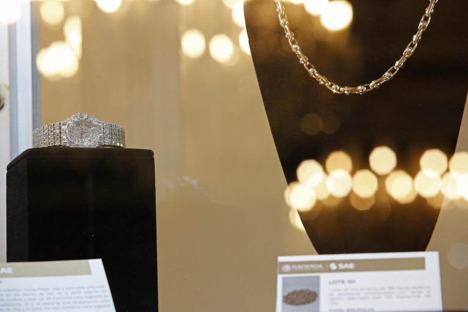 A men's watch is displayed during a public auction of government seized jewelry at Los Pinos Cultural Center, formerly the presidential residence, in Mexico City, Sunday, July 28, 2019. The watch is made of 18k white gold with 49 diamonds and had a starting price of 2,953,700.00 Mexican pesos (about $155,000 dollars). (AP Photo/Ginnette Riquelme)