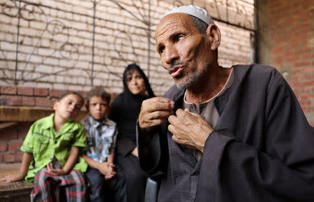 Abdallah Mahmoud, father of Youssef Abdullah, one of at least 22 Egyptians found dead earlier this month, perishing from heat and starvation after trekking the Libyan desert by foot, speaks in the village of Tarfa al-Kom in Minya province, Egypt, July 12, 2017. Picture taken July 12, 2017. REUTERS/Mohamed Abd El Ghany