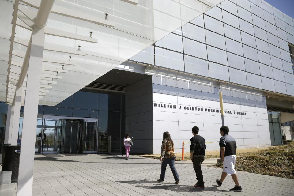 This photo taken March 13, 2014 shows visitors walking to the Clinton Presidential Library in Little Rock, Ark. The National Archives makes public another 4,000 pages of documents from the Clinton White House on Friday, including previously unreleased records related to Vice President Al Gore's 2000 presidential campaign and the 2000 recount in Florida. The records have been highly anticipated as former first lady Hillary Rodham Clinton considers a 2016 presidential campaign. (AP Photo/Danny Johnston)