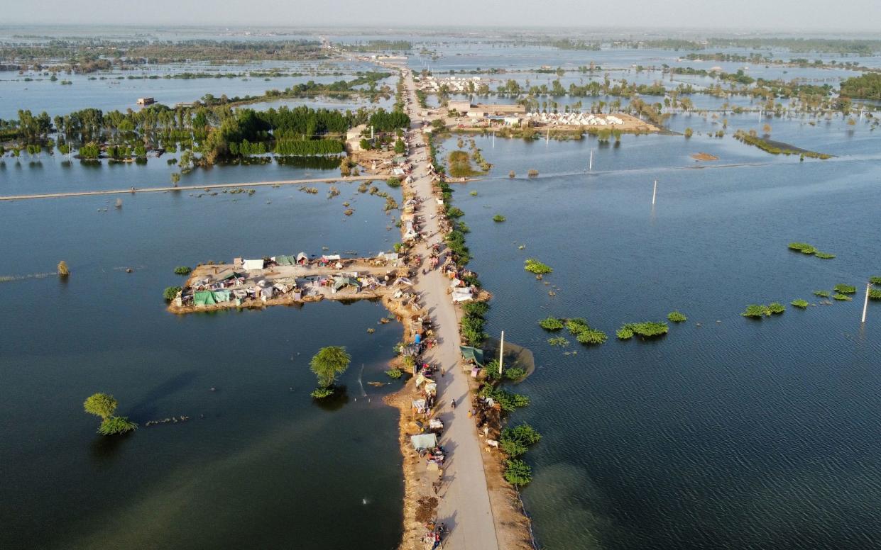 This aerial photograph shows makeshift tents for people displaced due to the floods after heavy monsoon rains at Sohbatpur in Jaffarabad district of Balochistan province on September 4, 2022 - FIDA HUSSAIN/AFP via Getty Images