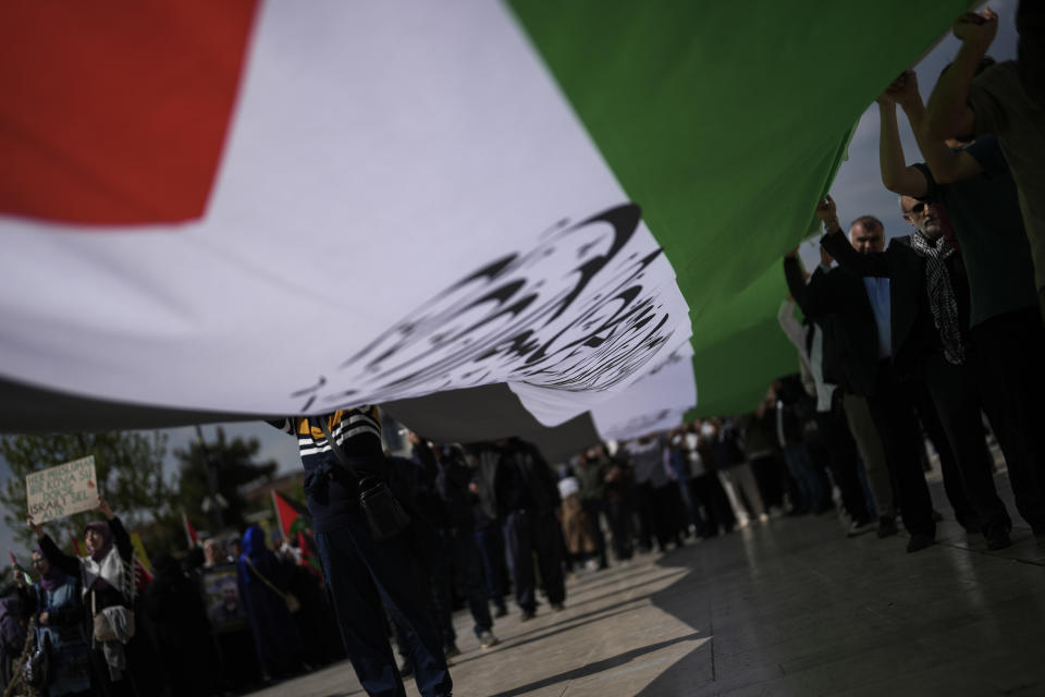 Supporters of Palestinians in Gaza protest in Istanbul, Turkey, Friday, April 5, 2024. (AP Photo/Khalil Hamra)