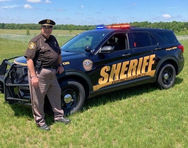 Undersheriff Keith Eichler with a new 2022 Ford Explorer road patrol vehicle put in service in June.