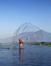 Michael Theodric, aged 10 from Indonesia, was the winner of the category '14 and under'. A fisherman man casts his net in Indonesia (Travel Photographer of the Year)