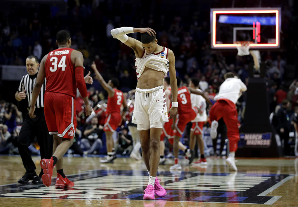 Iowa State's Tyrese Haliburton walks off the court after Iowa State lost to Ohio State in their first round men's college basketball game in the NCAA Tournament Friday, March 22, 2019, in Tulsa, Okla. Ohio State won 62-59. (AP Photo/Charlie Riedel)