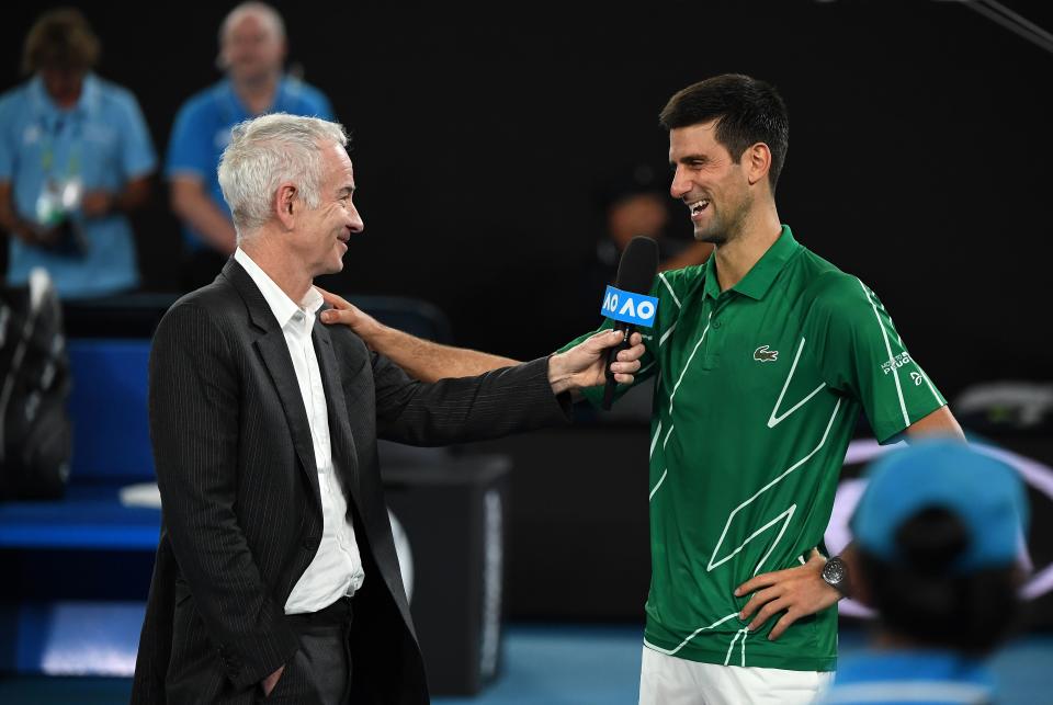 John McEnroe (pictured left) shares a laugh with Novak Djokovic (pictured right) during the Australian Open.