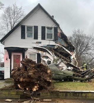 A fallen tree caused significant damage to this Franklin Street home in Weymouth on Monday, Dec. 18, 2023.